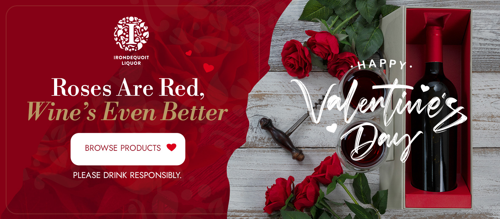 Red roses and a wine bottle in a gift box with Happy Valentines Day written beside them.