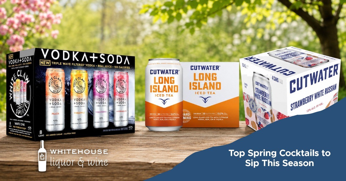 Assorted canned cocktails and seltzers displayed on a table with spring-themed packaging.