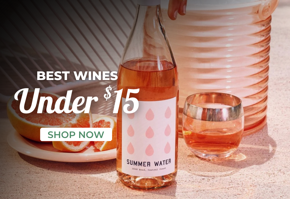 two bottles of liquor on picnic table with deep discounts and sale prices displayed