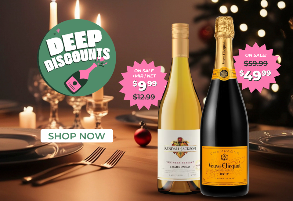 Two bottles of alcohol with sale prices and Deep Discounts in a festive autumn setting.