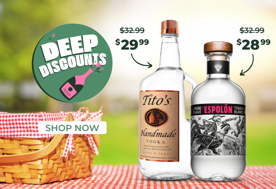 two bottles of liquor on picnic table with deep discounts and sale prices displayed