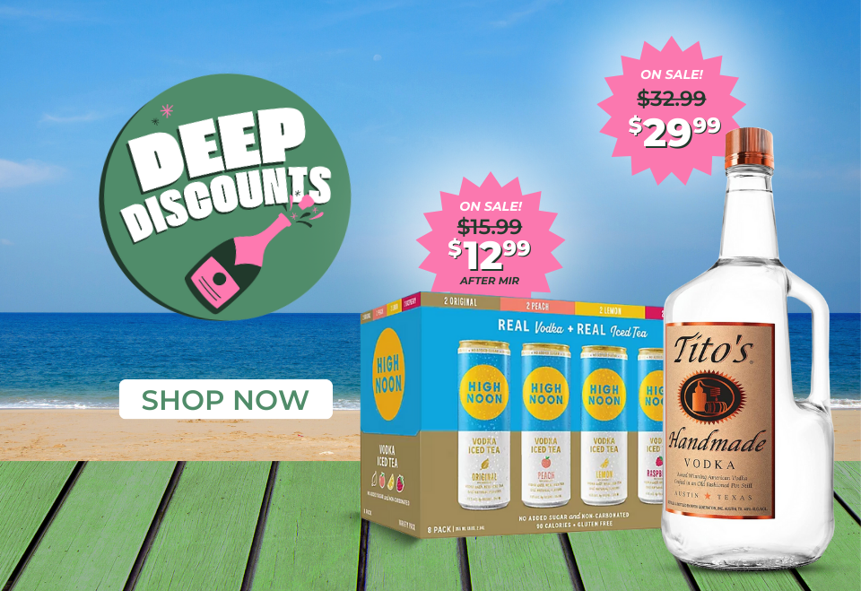 two bottles of liquor on picnic table with deep discounts and sale prices displayed