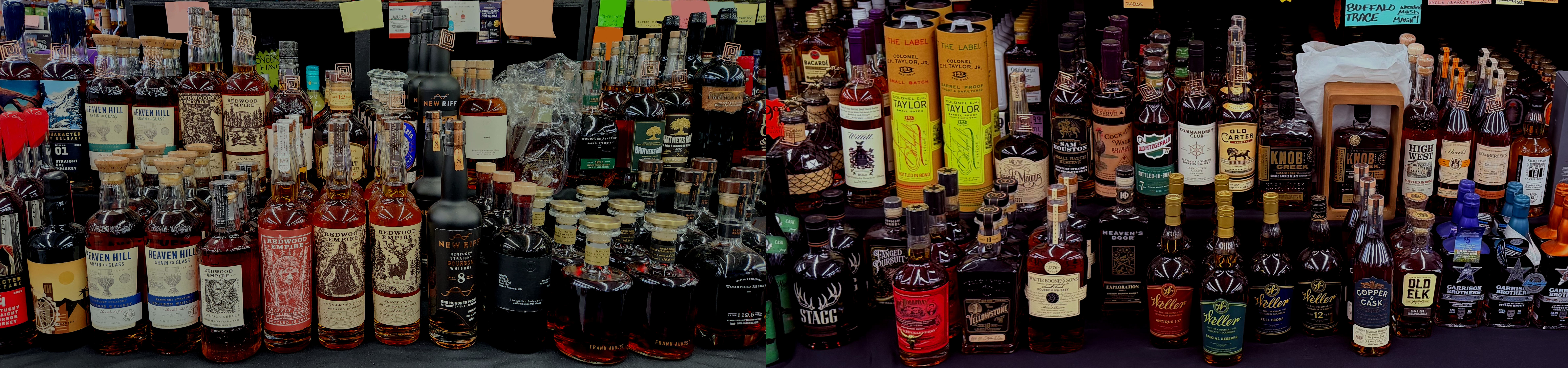 Variety of whiskey bottles arranged on a table, showcasing different brands and labels.